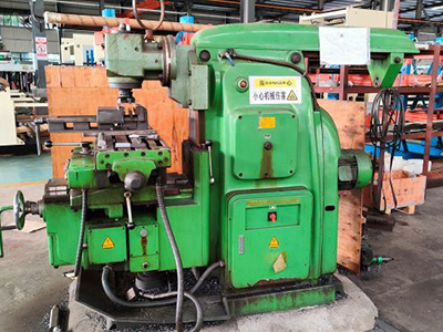 Rocker arm drill press for hole drilling